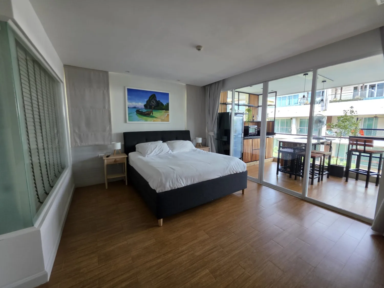 Spacious principal bedroom opening towards the private terrace