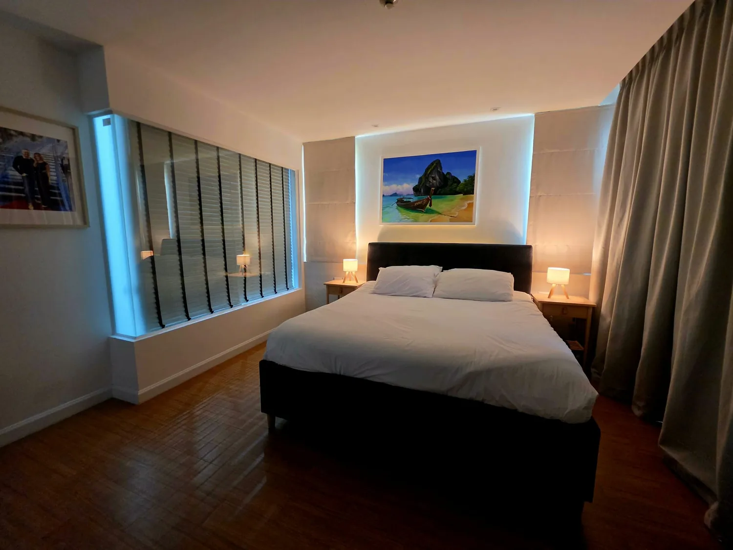 Principal bedroom with soft lighting and contemporary cabinetry